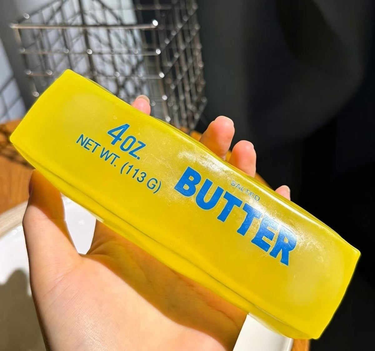 Butter Stick Squishy on a clean background — yellow butter stick squeeze toy