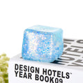 Glacier Dough Cube — pastel glitter dough cube with a slow rebound, side view