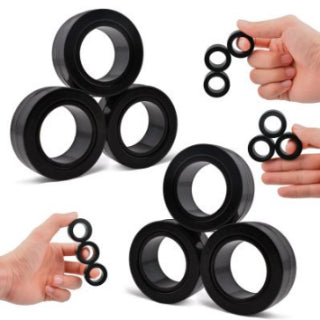 Magnetic Rings — Black magnetic fidget rings stacked and held in hand