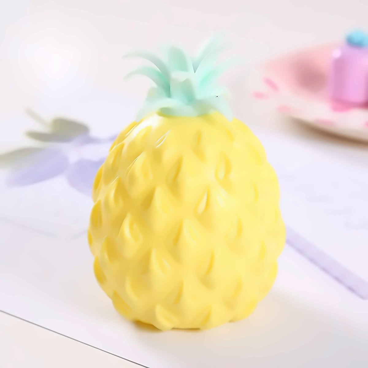 Pineapple Pop Ball — pineapple mesh pop squeeze ball, side view