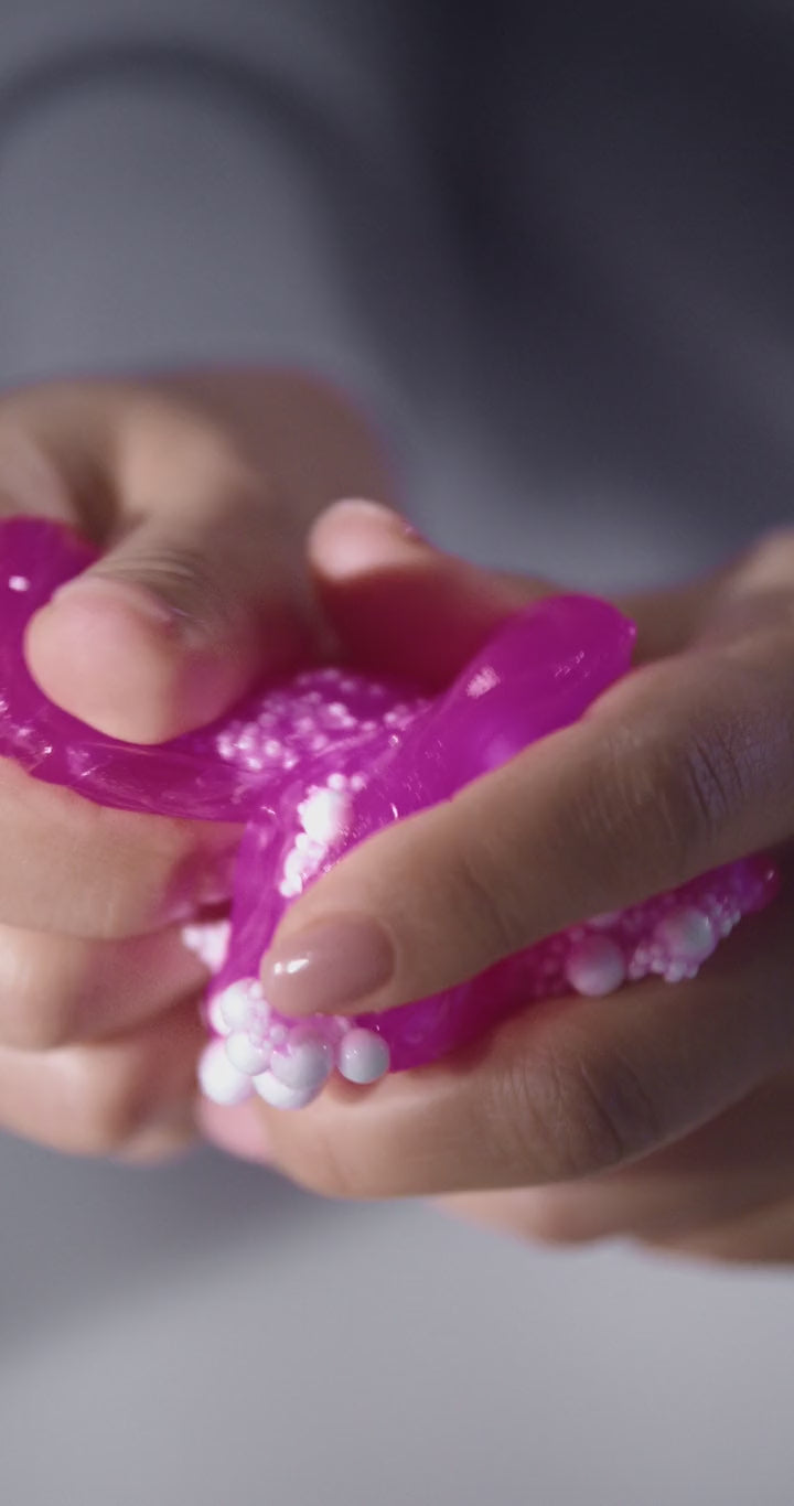 Moldable Crunch Ball — squeezed in hand, crunchy snow texture